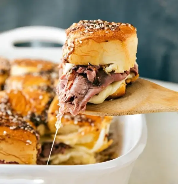 French dip slider sandwiches in a serving dish